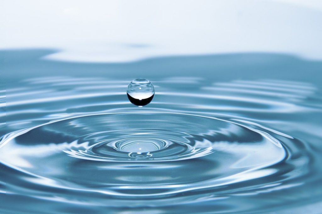 Clean water pouring into a glass